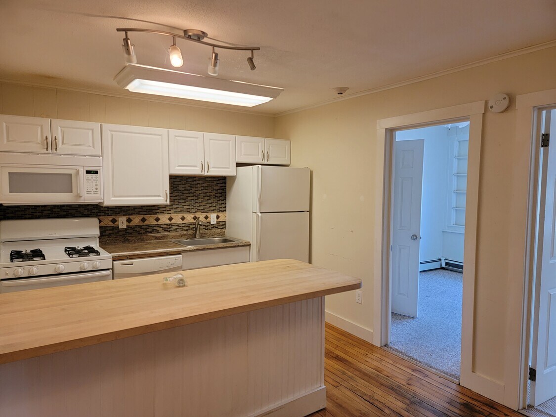 White appliances and butcher block countertop - 52 E Bowery St