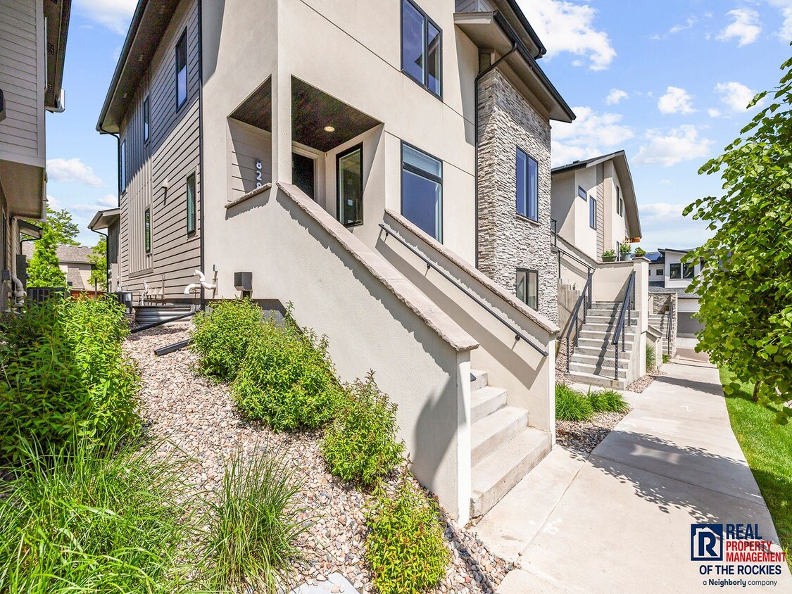 Primary Photo - Spacious 3-Bedroom Townhome with Finished ...