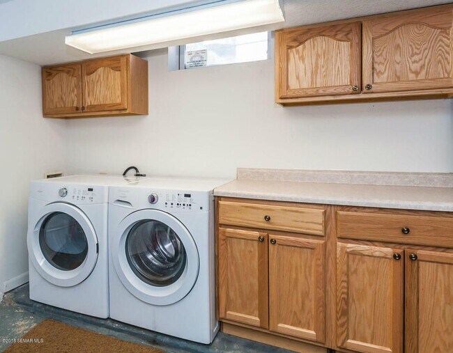 Washer/Dryer in large utility space in basement with great storage. - 1307 14th St NW