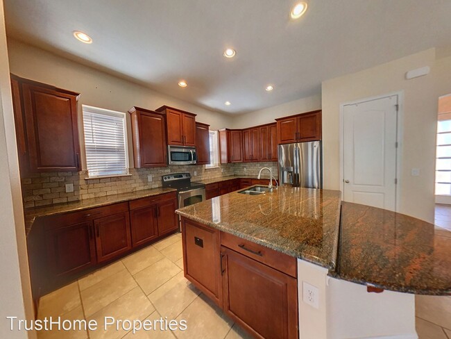 Building Photo - 4 br, 3.5 bath House - 8453 Laureate Blvd