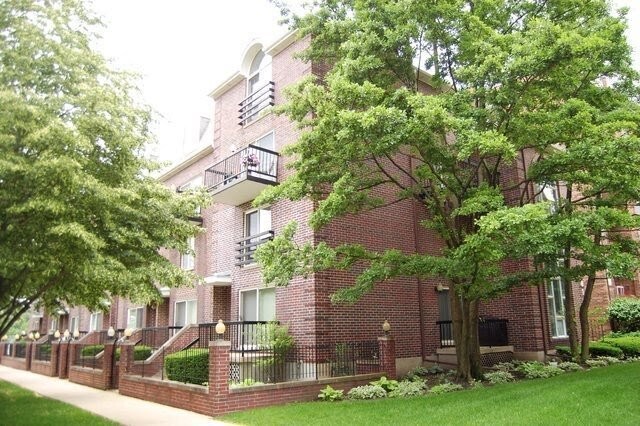 Front view with balconies and front yard - 815 Pearson St