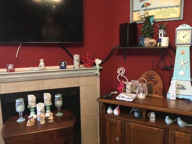 A corner of the living room with fully functioning fireplace - 859 Shoreline Cir