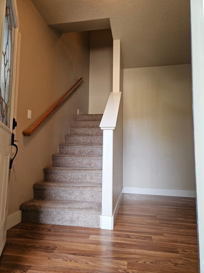 Entry with stairs to bedrooms - 2014 E Mountain Man Dr