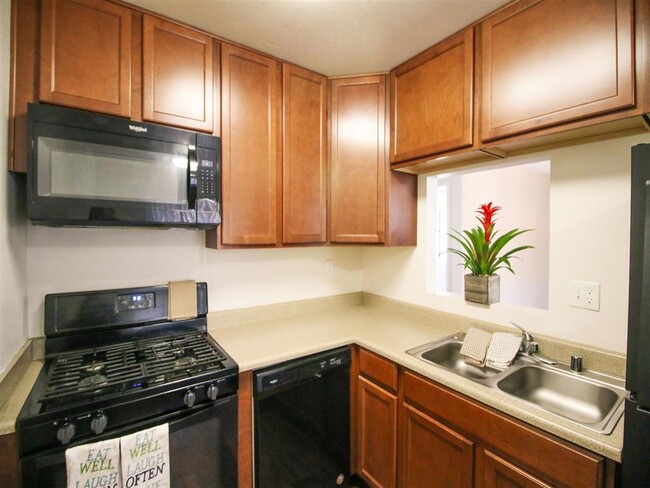 Modern Kitchen with Microwave at Creekside Villas Apartments - Creekside Villas Apartments