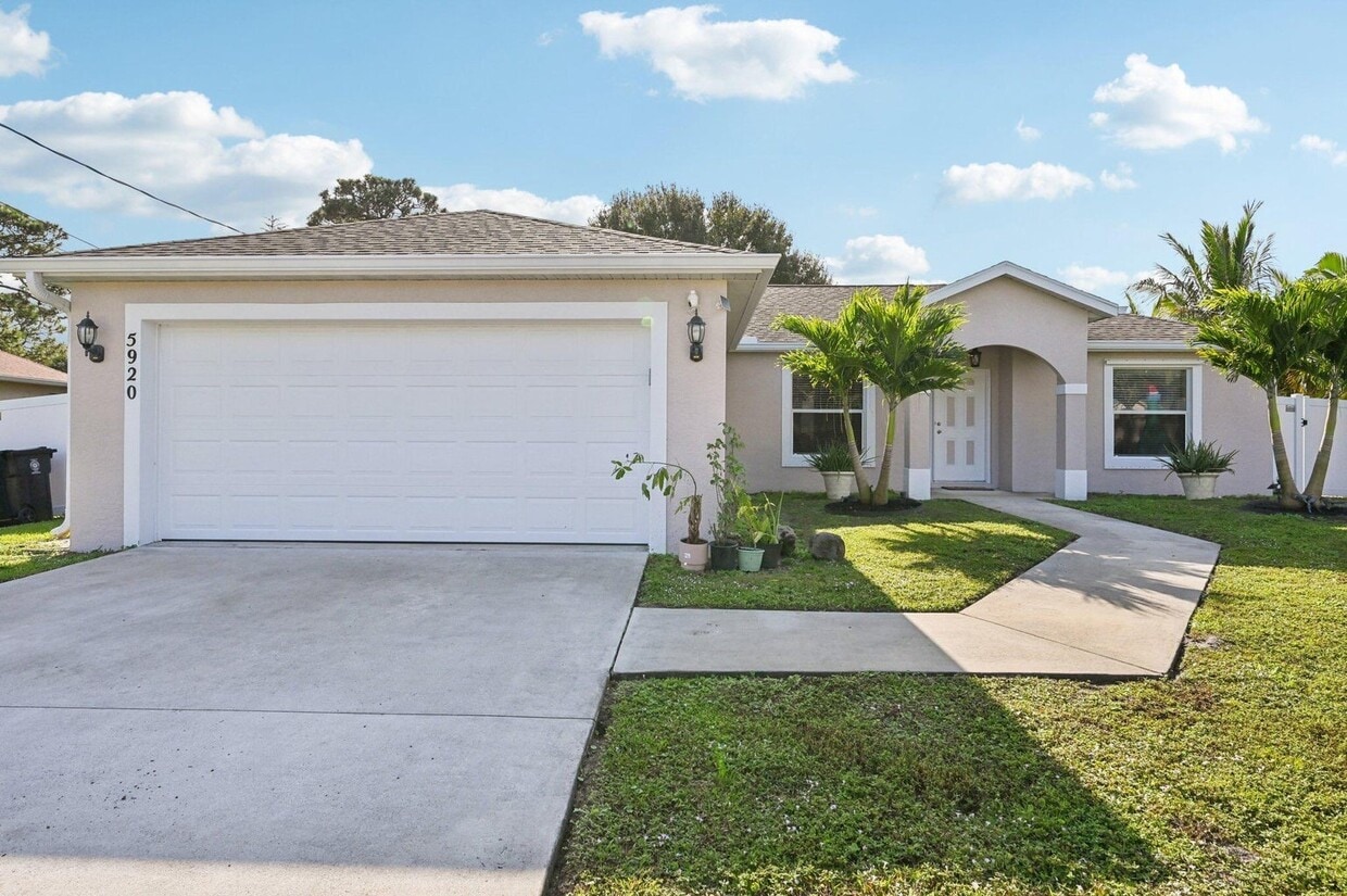 Photo - 5920 Northwest Wolverine Road, Port St. Lucie, FL 34986 - 3 BR 2 BA single-family home