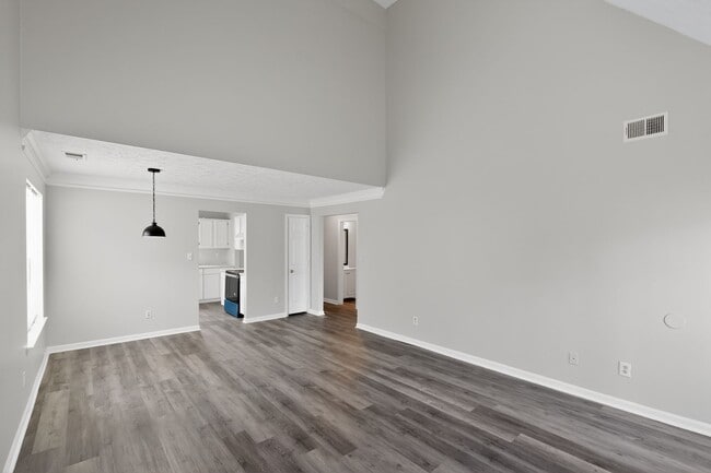 Living room, dining area, and access to kitchen - 1029 Plantation Way NW