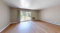 Located at 300 Glen Meadow Rd in Franklin, MA, this 2-bedroom, 1-bathroom residence offers a well-designed, single-floor layout with a clean, neutral aesthetic throughout. Light hardwood flooring runs consistently across all rooms, lending a warm and cohesive feel to the entire space.

The living room is a bright and airy area highlighted by a large sliding glass door that opens to an outdoor balcony, inviting natural light and views of the surrounding greenery. The kitchen is functional and well-appointed, featuring warm wood cabinetry, granite-style countertops, and white appliances including a refrigerator, range, microwave, and dishwasher.

The primary bedroom is generously sized, offering a built-in double closet with louvered doors, providing ample storage. The second bedroom is comfortable and well-lit, with multiple windows that bring in natural light and views of the exterior. Both bedrooms include baseboard heating. The full bathroom features a tub-shower combination with a clean, all-white surround, tile flooring, and grab bar accessibility features.

A connecting hallway ties the layout together efficiently. The overall design is simple, clean, and move-in ready, making this a practical and comfortable residence in Franklin, MA.