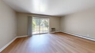 Located at 300 Glen Meadow Rd in Franklin, MA, this 2-bedroom, 1-bathroom residence offers a well-designed, single-floor layout with a clean, neutral aesthetic throughout. Light hardwood flooring runs consistently across all rooms, lending a warm and cohesive feel to the entire space.

The living room is a bright and airy area highlighted by a large sliding glass door that opens to an outdoor balcony, inviting natural light and views of the surrounding greenery. The kitchen is functional and well-appointed, featuring warm wood cabinetry, granite-style countertops, and white appliances including a refrigerator, range, microwave, and dishwasher.

The primary bedroom is generously sized, offering a built-in double closet with louvered doors, providing ample storage. The second bedroom is comfortable and well-lit, with multiple windows that bring in natural light and views of the exterior. Both bedrooms include baseboard heating. The full bathroom features a tub-shower combination with a clean, all-white surround, tile flooring, and grab bar accessibility features.

A connecting hallway ties the layout together efficiently. The overall design is simple, clean, and move-in ready, making this a practical and comfortable residence in Franklin, MA.