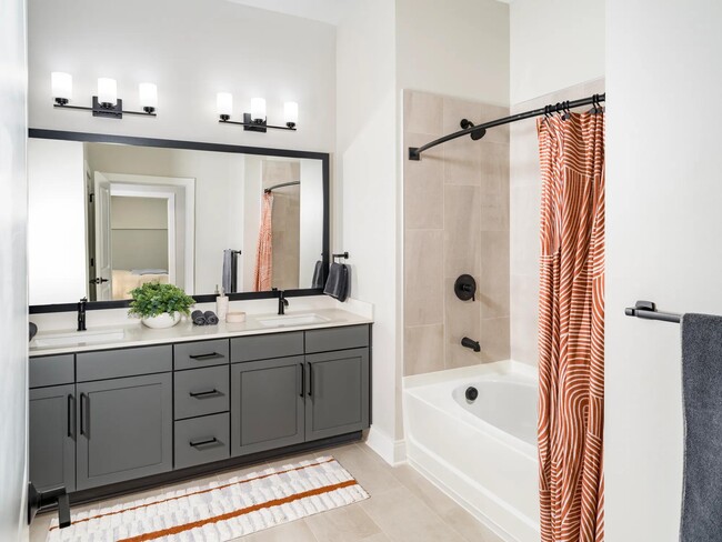 Sophisticated bathrooms at Modera Liberty Row feature dual vanities, sleek finishes, and spacious layouts designed for comfort in Charlotte. - MAA Liberty Row