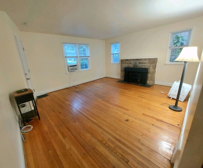 Spacious living room featuring a fire place. - 1717 Springfield Ave