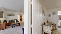 Located at 2074 Midyette Rd in Tallahassee, FL, this single-story home offers a practical and well-organized layout across three bedrooms, two bathrooms, an office, and two closets. The open-concept kitchen features white cabinetry with light wood accents, laminate countertops, a gas range, and wood-look flooring. A peninsula with bar-style seating connects the kitchen to the living area and includes a convenient walk-in pantry closet nearby. The living room is bright and inviting, with plush carpet, large windows that invite natural light, and direct access to an outdoor patio area. The dedicated office space is carpeted and includes a window with natural light, making it a functional workspace. The primary bedroom offers a generous footprint with a walk-in closet featuring built-in wire shelving for organized storage. Additional bedrooms are cozy and carpeted, well-suited for various uses. The bathrooms are clean and functional, with vanity lighting, single-sink counters, and a neutral color palette. Throughout the home, a consistent white wall palette and combination of carpet and wood-look flooring create a cohesive, move-in-ready feel.