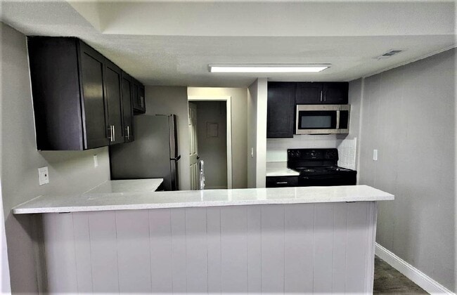 Upgraded Kitchen - Woods at Oak Crossing