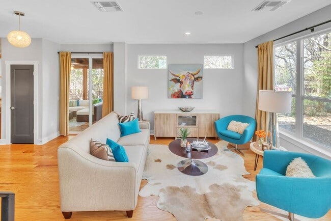 Living room, access to screened porch - 402 Irma Dr