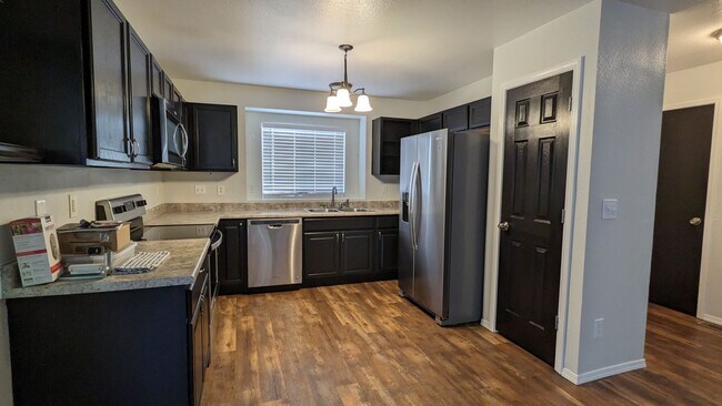 Building Photo - RANCH 4 BED/2 BATH WITH FINISHED BASEMENT AND 2 CAR GARAGE!