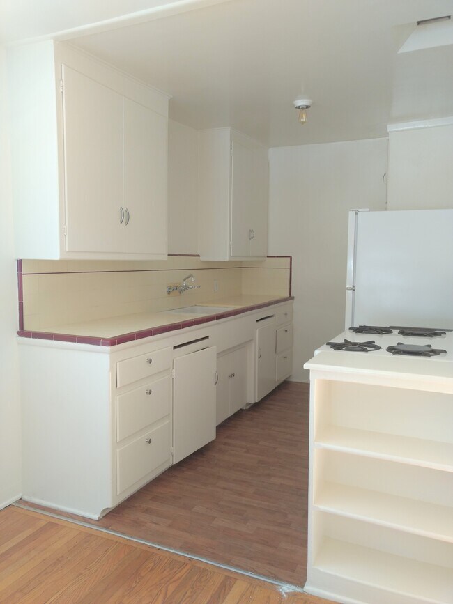 Kitchen with new refridgerator - 715 Pacific St