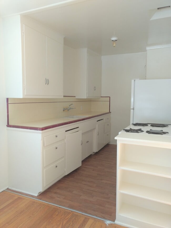 Kitchen with new refridgerator - 715 Pacific St