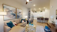 Located in Orlando, FL, this thoughtfully designed 1-bedroom, 2-bathroom residence offers an efficient and stylish single-floor layout. The open-concept living and kitchen area serves as the heart of the home, featuring light wood-style flooring, recessed lighting, and a ceiling fan that enhances the bright, airy atmosphere. Large wall art and neutral tones create a welcoming ambiance in the living space.

The kitchen is outfitted with white shaker-style cabinetry accented by matte black hardware, dark quartz countertops, a white subway tile backsplash with under-cabinet lighting, and a full suite of stainless steel appliances. A peninsula with seating provides a convenient dining option and additional workspace.

The bedroom is a serene retreat, featuring natural light from a window with drapes, ceiling fan, wood-style flooring, and a dedicated closet for storage. Both bathrooms are finished with white vanity cabinetry, dark quartz countertops, large mirrors, and tub/shower combinations with tile surrounds. A hallway connects the private areas of the home seamlessly to the main living spaces, completing this cohesive and functional floor plan.