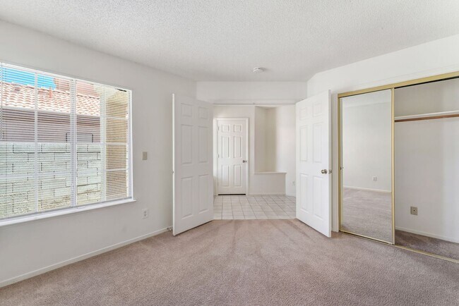 Building Photo - Vaulted Ceilings, Cozy Fireplace & Desirable Single-Story Living Near The Lakes!