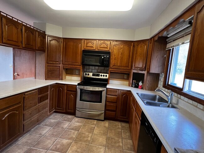 Kitchen with lots of storage - 210 Elm Ave S