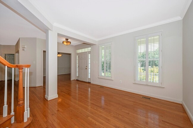 Building Photo - Main Level Primary Suite & Soaring Two Story Family Room