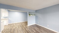 Located at 805 Linda Vista Ave in Arlington, Texas, this single-story 2-bedroom, 1-bathroom residence offers a cohesive and thoughtfully designed interior. Throughout the home, soft light blue walls and wood-look laminate flooring create a calm, consistent aesthetic that ties every room together.

The open living and dining area provides a comfortable, functional layout with a decorative wall shelf and natural light streaming through large windows. The galley-style kitchen is well-appointed with white cabinetry, granite-patterned countertops, a stainless steel sink, and white appliances, offering ample storage and counter space for everyday use.

The primary bedroom is a generous size, featuring a ceiling fan, a window with exterior views, and convenient closet access. The second bedroom is equally bright with clean walls and wood-look flooring. A total of four closets are distributed throughout the home, providing abundant storage options. The full bathroom includes a tub-shower combination with white subway tile surround, chrome fixtures, and a clean, minimalist finish.

A hallway connects the rooms efficiently, and the textured ceilings add a classic touch throughout. The overall ambiance is fresh, clean, and move-in ready, making this residence a practical and comfortable home in the heart of Arlington.