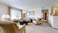 Located at 4430 Emerald Lakes Blvd in Powell, Ohio, this efficiently designed one-bedroom, one-bathroom residence offers a well-organized single-floor layout that maximizes every square foot. The inviting living room is bathed in natural light through large windows dressed with grommet-panel curtains, and features soft wall-to-wall carpeting and a textured ceiling that adds character throughout. The galley-style kitchen is lined with warm oak cabinetry, ample counter space, and white appliances including a range and refrigerator, with tile flooring for easy maintenance. Adjacent to the kitchen, the dining area comfortably accommodates a round table and chairs, creating a cozy space for everyday meals. The spacious bedroom offers a tranquil retreat with natural light from a dedicated window, carpeted flooring, and generous storage via a walk-in closet featuring built-in shelving and hanging rods. A versatile office space adds functional flexibility to the floor plan. The full bathroom includes a soaking tub and shower combination, a wood-vanity with integrated sink, and tile flooring. A dedicated in-unit laundry area with side-by-side washer and dryer hookups adds everyday convenience to this thoughtfully laid-out home.