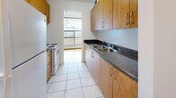 This well-designed 760 square foot apartment in Toronto offers a practical and comfortable living space. The unit features two bedrooms, including a primary bedroom of 110 square feet, and one bathroom. The interior is characterized by its bright and airy ambiance, achieved through white walls and large windows that allow natural light to flood the rooms.

The flooring throughout is a standout feature, with beautiful parquet hardwood in a warm honey tone adding character and warmth to the living areas and bedrooms. The kitchen, while compact, is efficiently designed with ample cabinetry in a light wood finish, complemented by dark granite countertops and modern appliances. White tile flooring in the kitchen provides a clean, easy-to-maintain surface.

The bathroom is finished with large, neutral-toned tiles from floor to ceiling, creating a sleek and contemporary look. A standard bathtub with shower fixture offers versatility for daily routines. Storage is addressed with a closet featuring a practical hanging rod system.

The apartment's layout includes a hallway connecting the various rooms, enhancing the sense of space and flow. Despite its modest size, the thoughtful design and use of light colors make the apartment feel more spacious than its 760 square feet might suggest. Located at 235 Gosford Blvd in Toronto, this single-floor unit offers a comfortable urban living solution with a blend of functionality and modern aesthetics.