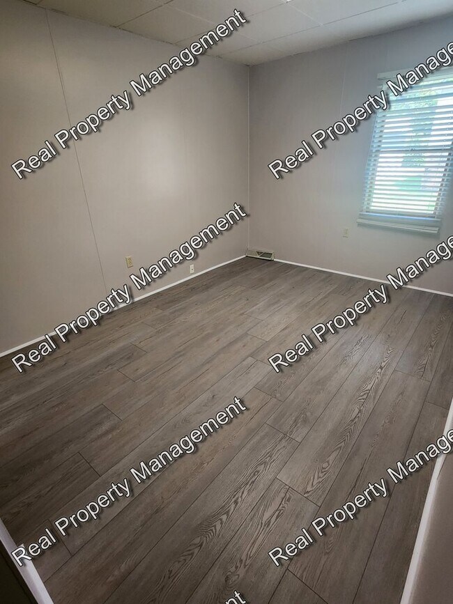 Building Photo - One Bedroom All Utilities Included