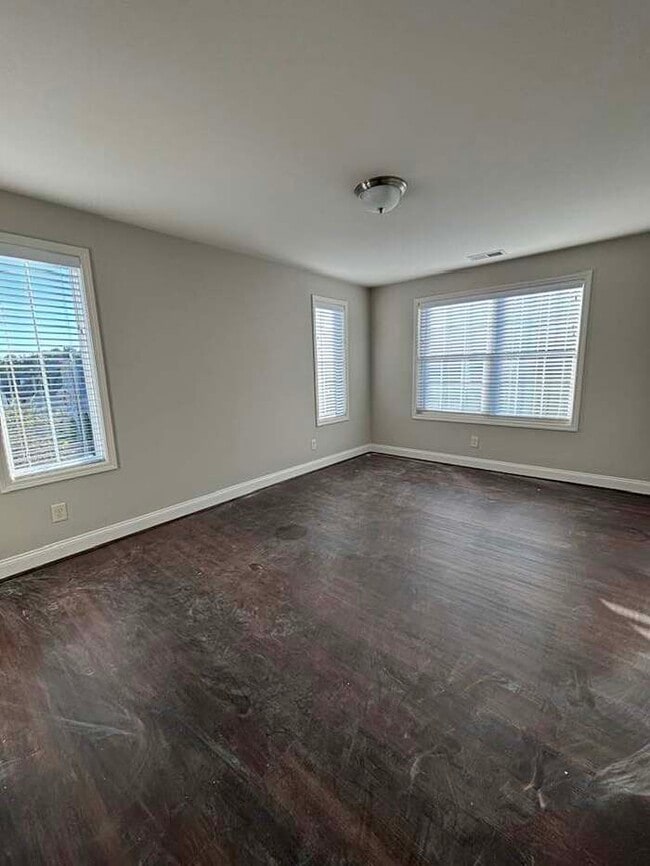 Building Photo - Corner unit, fenced-in backyard, 2 car gar...
