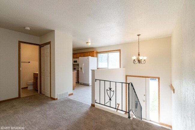 Building Photo - 3 Bedroom townhome, Open Now, garage, 2 bathrooms, W/D Etc.