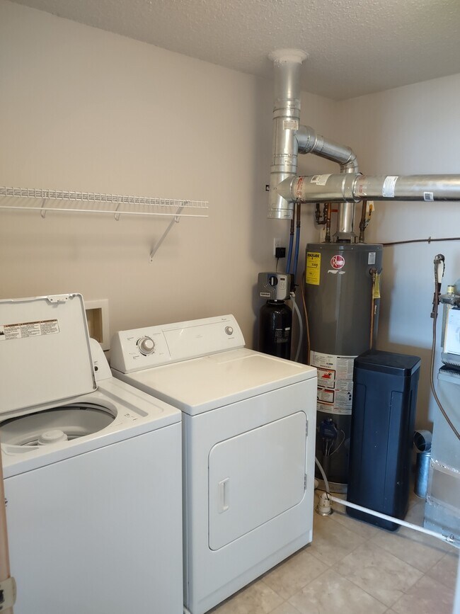 Washer and dryer in utility room - 9640 Peony Ln N