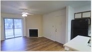 Located at 1878 E Nine Mile Rd in Pensacola, Florida, this single-story space offers a clean, functional layout with timeless design details. The living area serves as the heart of the space, showcasing rich hardwood flooring that adds warmth and character throughout. A classic fireplace anchors one wall, providing a cozy focal point, while a ceiling fan overhead ensures comfortable airflow year-round. The walls are finished in a soft, neutral palette that creates a bright and welcoming atmosphere, complemented by a textured ceiling that adds subtle visual interest. Natural light filters into the room through a sliding glass door or large window on one side, lending an open and airy feel to the interior. A dedicated entryway door offers a clear and convenient point of access. The overall layout is straightforward and versatile, providing a well-proportioned living environment suited to a variety of uses. The combination of hardwood floors, the fireplace, and the understated finishes throughout gives the space a comfortable, move-in-ready character with lasting appeal in a convenient Pensacola location.