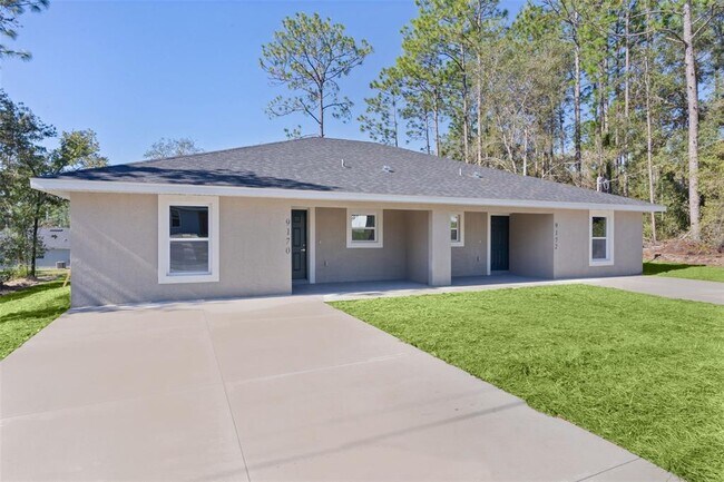 Foto del edificio - 9170 N Travis Dr