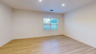 Located at 175 Rock Rd in Bergen, NJ, this well-appointed 3-bedroom, 2-bathroom unit offers a thoughtfully designed single-floor layout with modern finishes throughout. The open-concept kitchen and living area serves as the heart of the home, featuring warm honey-toned wood cabinetry, white quartz countertops, a classic subway tile backsplash, and a full suite of stainless steel appliances including a refrigerator, range, microwave, and dishwasher. A central kitchen island provides additional prep and storage space. Light hardwood flooring flows seamlessly throughout the entire unit, creating a bright and cohesive aesthetic. Recessed lighting illuminates each room, complementing the natural light that enters through multiple windows. The generously sized primary bedroom includes a dedicated walk-in closet with built-in shelving and a private en-suite bathroom finished with neutral tile flooring, a wood-toned vanity, white quartz countertop, and a glass-door walk-in shower. Two additional bedrooms feature sliding or panel-style closets and offer comfortable proportions. A second full bathroom serves the remaining bedrooms. Clean white walls, modern trim, and a consistent design language give the entire space a fresh, move-in-ready feel.