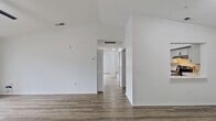 Step into a world of contemporary elegance and effortless living. This freshly updated home boasts sleek wood-look flooring throughout, creating a seamless flow from room to room. The heart of the home, a stunning kitchen and living area, invites you to entertain in style with its crisp white cabinetry, subway tile backsplash, and stainless steel appliances. Bright, airy bedrooms, including a spacious 160 sq ft primary suite, provide tranquil retreats. Modern bathrooms featuring chic fixtures and ample natural light complete this urban oasis. Embrace the Florida lifestyle with a private balcony, perfect for morning coffee or evening relaxation. This turnkey property offers the canvas for your aspirational lifestyle, blending comfort, style, and convenience in one of Sarasota's most desirable locations.