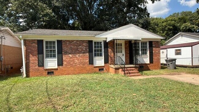 Building Photo - Three bedroom brick home available now!