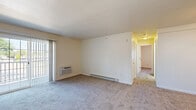 Located at 3121 Janesville Ct in Janesville, WI, this 2-bedroom, 1-bathroom single-floor unit offers a practical and comfortable layout. The living room is a generous, open space featuring plush carpeting, a ceiling fan with light fixture, baseboard heating, and a sliding glass door that fills the room with natural light and provides access to a balcony with outdoor views. A wall-mounted air conditioning unit ensures year-round comfort.

Both bedrooms are carpeted and feature ceiling fans, baseboard heating, and windows that bring in natural light. The primary bedroom is a well-proportioned room with two closets — including a dedicated storage closet — offering ample storage space. The second bedroom similarly features a window with blinds and a ceiling fan, creating a bright and airy feel.

The full bathroom is finished with clean, neutral tones and includes a full tub-and-shower combination with chrome fixtures and towel bars, a toilet, and wood-look flooring, providing a crisp, functional space. Throughout the unit, neutral cream-colored walls and consistent carpeting create a cohesive, move-in-ready aesthetic that offers a blank canvas for personalization. The efficient single-floor layout ensures easy navigation between all rooms.