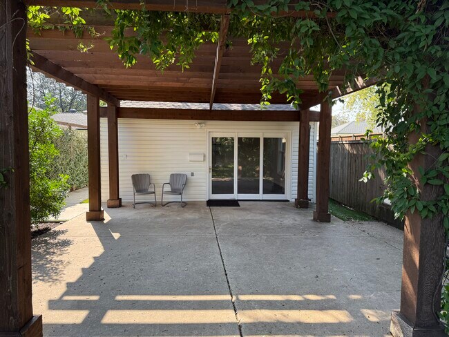 Exterior with pergola and shaded patio - 3925 Gaspar Dr