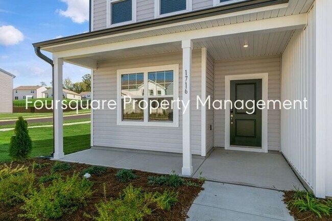 Foto del edificio - 4 Bedroom Home with 2nd Floor Loft- Kitchen Island & 2-Car Garage – Convenient Raleigh Location