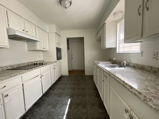 Building Photo - Three bedroom two bath house available in ...