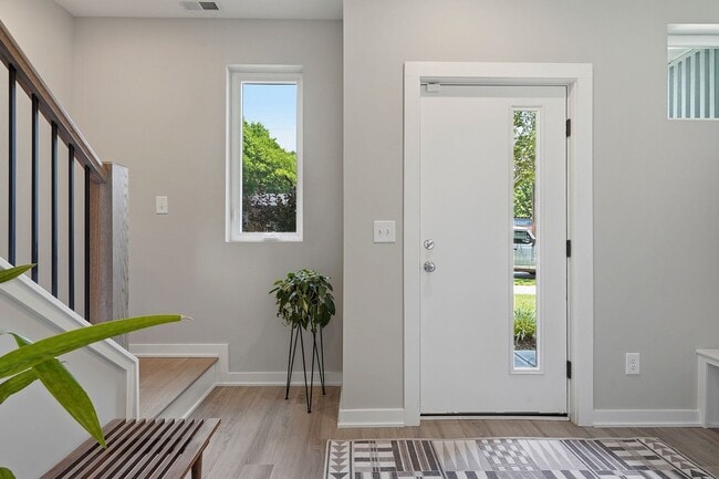 Building Photo - Live Elevated in Downtown Raleigh – Stunning Townhome with Rooftop Oasis!