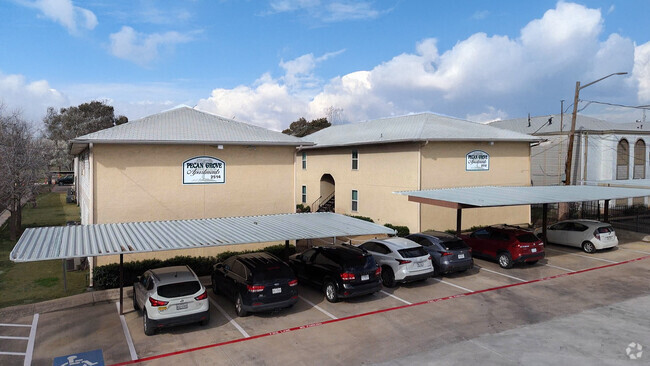 Exterior on W. Hickory St. - Pecan Grove Apartments