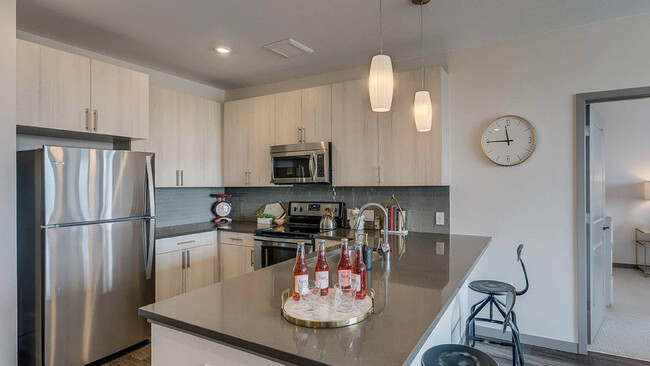 Kitchen with Stainless Steel Appliances - The Den