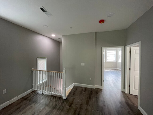 Unit two: (left to right) view of staircase/entry, master bedroom, bedroom one. - 34 Falcon St