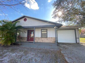 Building Photo - 2/2 home with garage - tile on inside with...