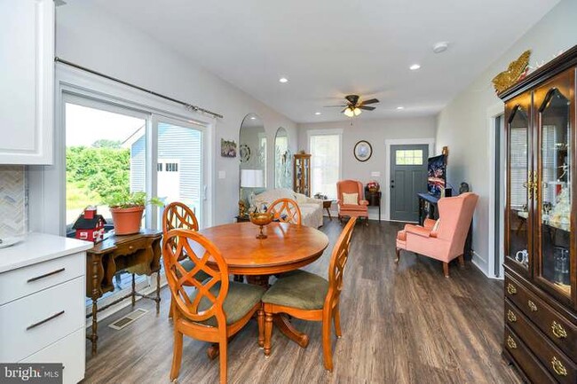 Dining area, furniture will be removed. - 7704 Loch Lomond Ct