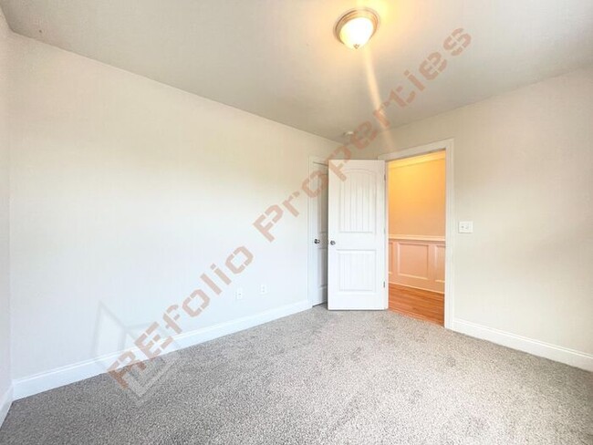 Building Photo - Fresh Paint and New Carpet Flooring! Beaut...