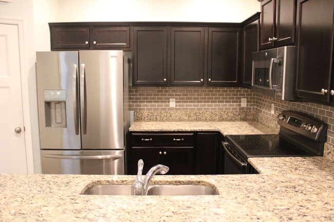Building Photo - Spectacular Townhouse!  "ASK ABOUT OUR ZER...