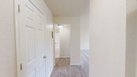 Located at 4085 Warner Ave in Hyattsville, MD, this one-bedroom unit offers a practical and comfortable layout across a single floor. The combined kitchen and living room serves as the heart of the home, where plush wall-to-wall carpeting extends through the open living area beneath a ceiling fan, creating a warm and inviting atmosphere. Sliding glass doors flood the space with natural light and lead directly to a private outdoor balcony, enhancing the sense of openness. A side window provides additional daylight to the living area.

The galley-style kitchen is efficiently designed with light wood cabinetry, granite-look countertops, tile flooring, and black appliances including a gas range and full-size refrigerator. A breakfast bar with an overhang connects the kitchen to the living space, offering a casual dining option.

The bedroom is generously proportioned with soft carpeting, a large window that invites natural light, and a bi-fold closet providing ample storage. Two interior doors lead to both the hallway and an additional closet, offering organizational flexibility.

A connecting hallway ties the rooms together, completing this well-organized and functional single-floor layout suited for comfortable everyday living.