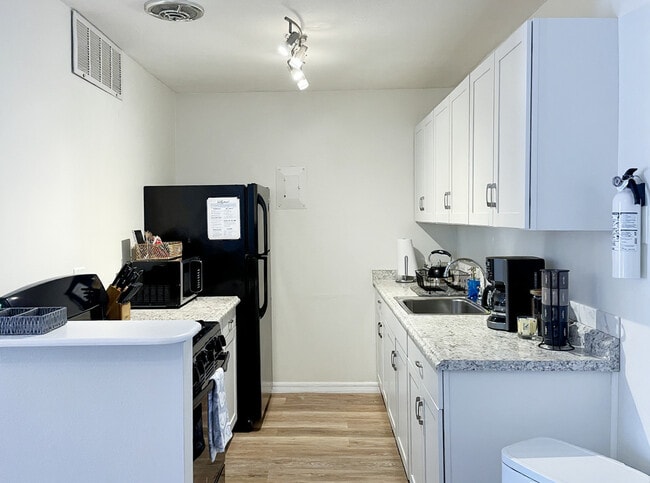 Fully equipped kitchen, stocked coffee station - 1700 SW 16th Ct